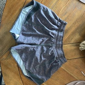 Gray lululemon size 6 tall athletic shorts with side zipper pocket.